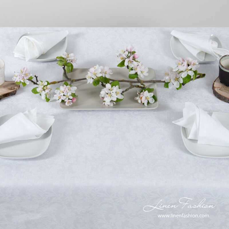 White linen tablecloth with flower ornaments