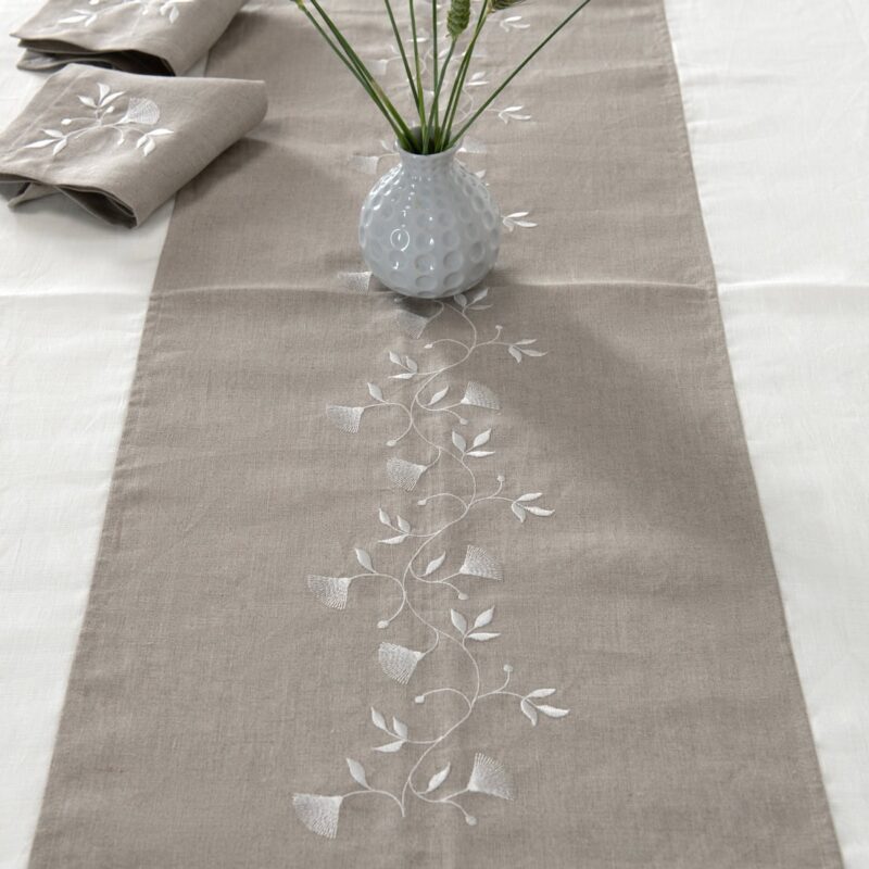 Off-white tablecloth with natural linen middle, matching napkins available