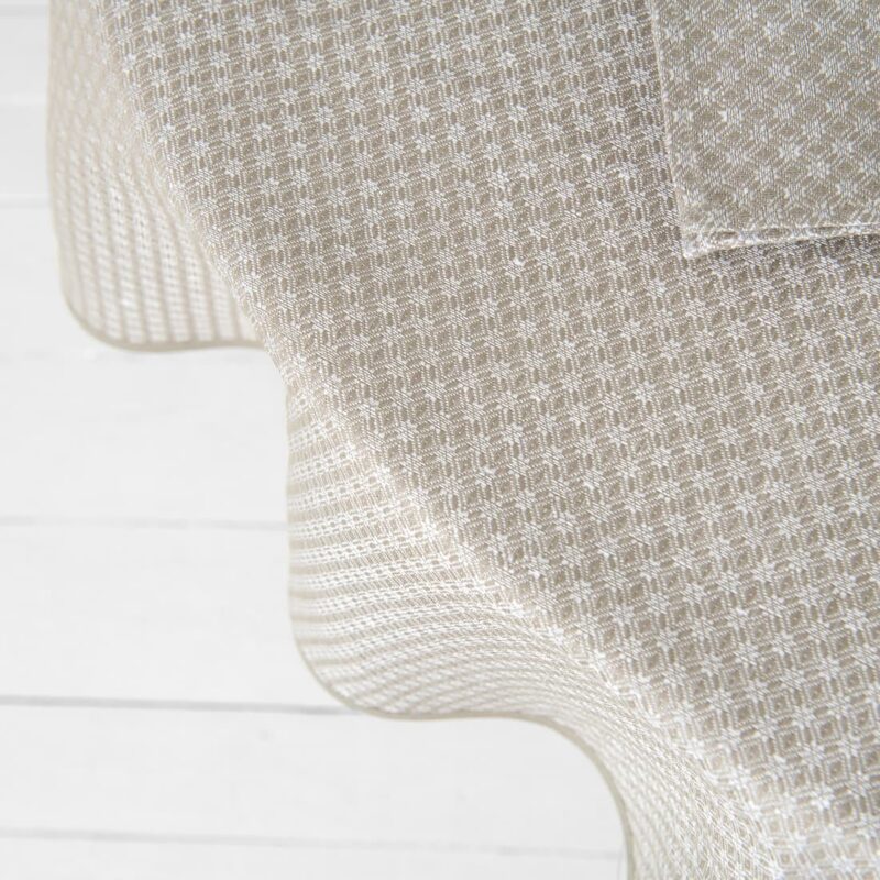 Round/oval linen cotton beige tablecloth, close top view