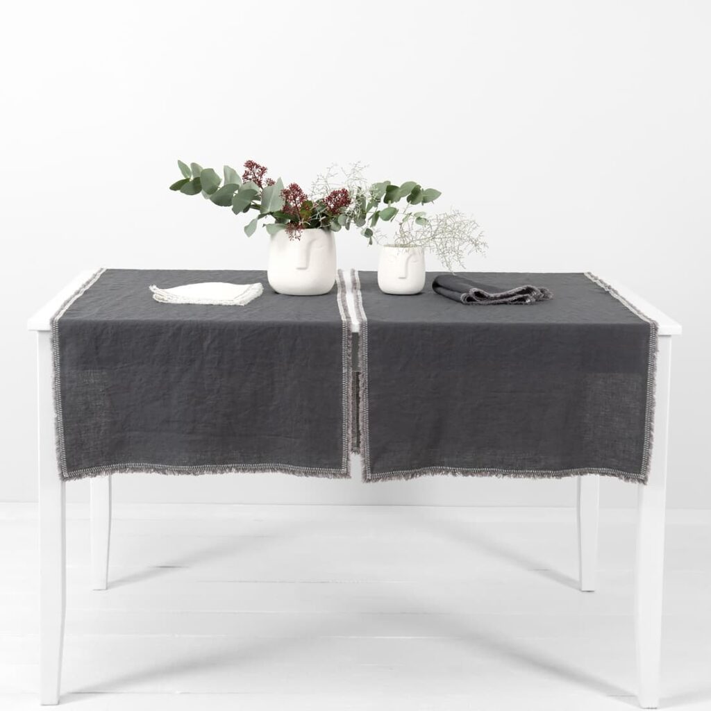 grey linen runner with decorative stitch