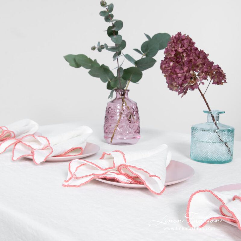 ARVO white linen tablecloth with rosy border and matching napkins