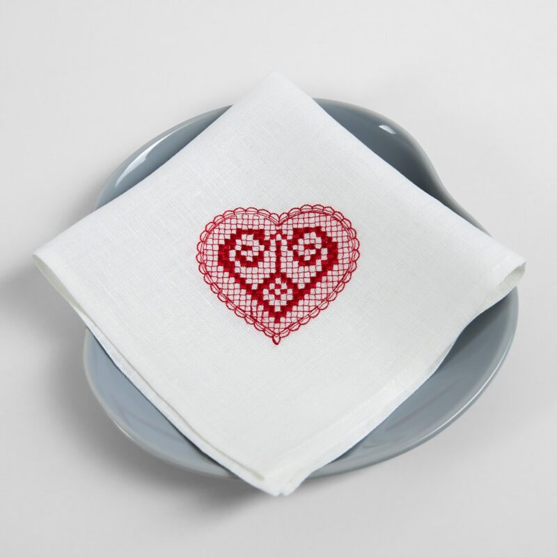 White linen napkin with red embroidery
