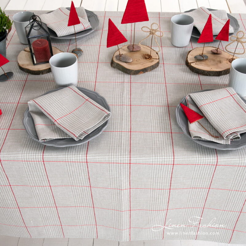 Grey checked tablecloth with red squares and matching napkins
