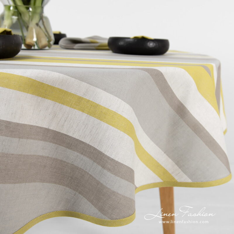 Linen round oval tablecloth striped with piping.