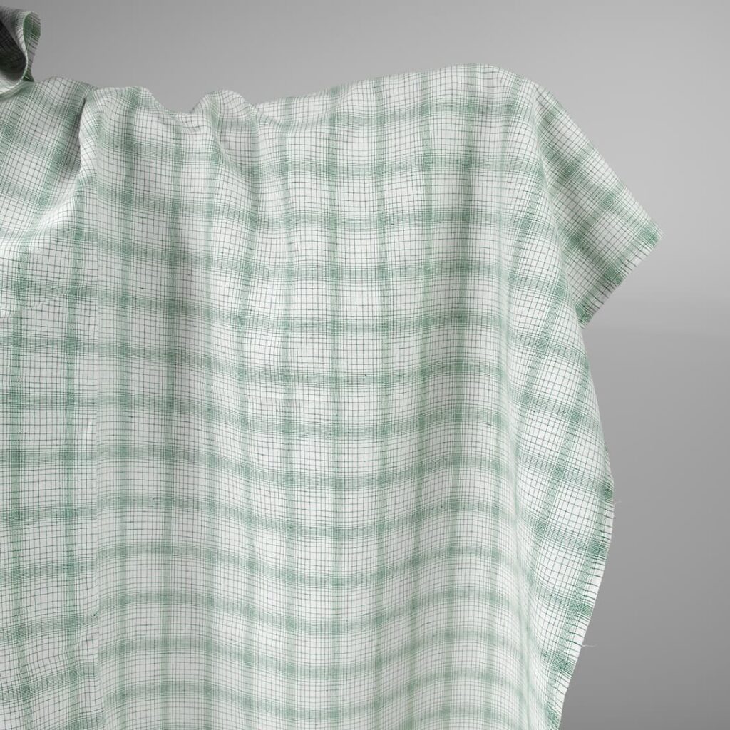 White linen cotton fabric with striped green checks