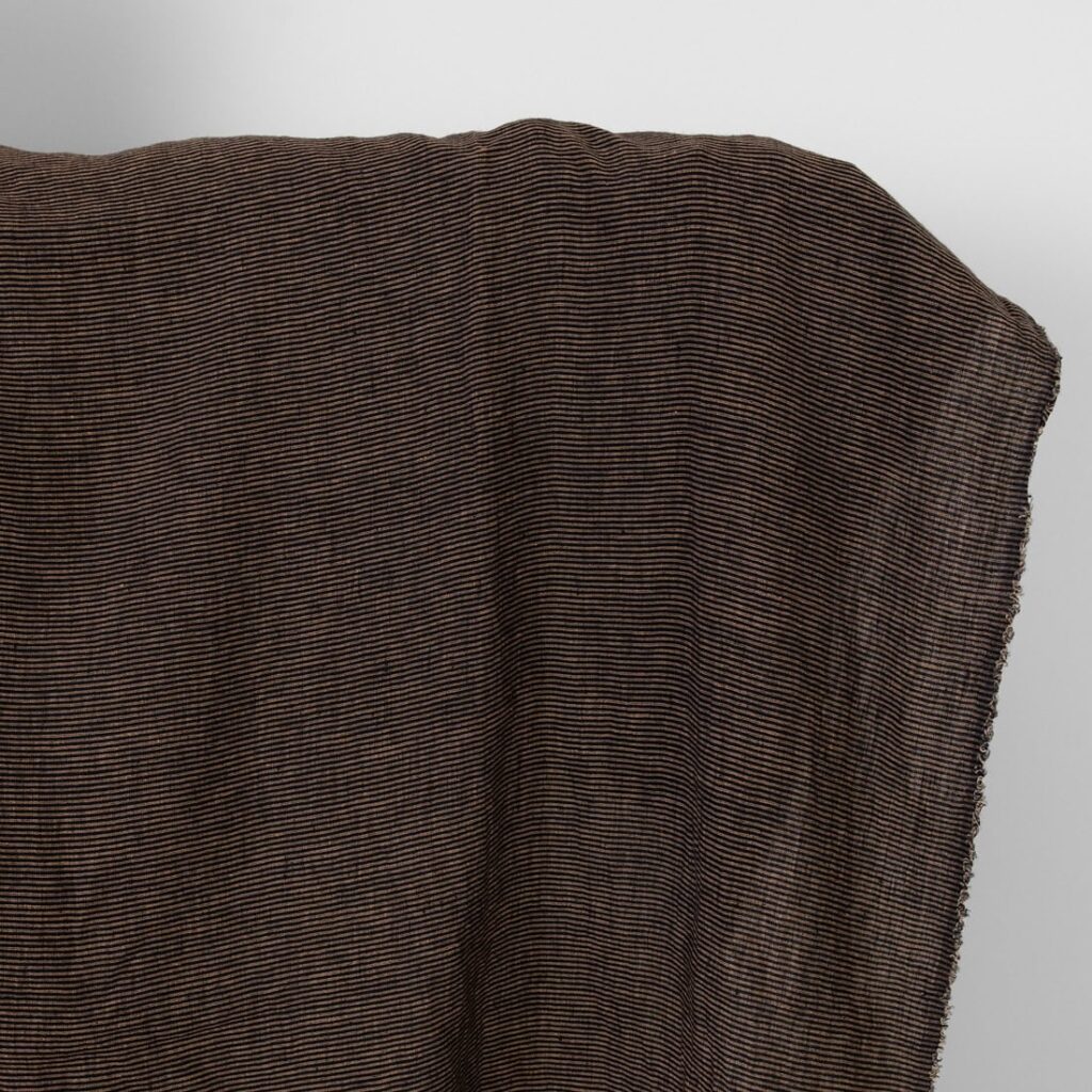 Linen fabric black with small clay stripes washed