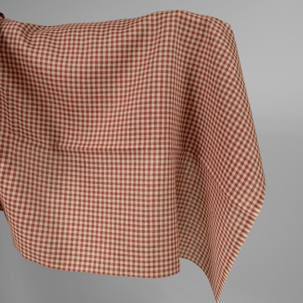 Linen fabric in sand red checks