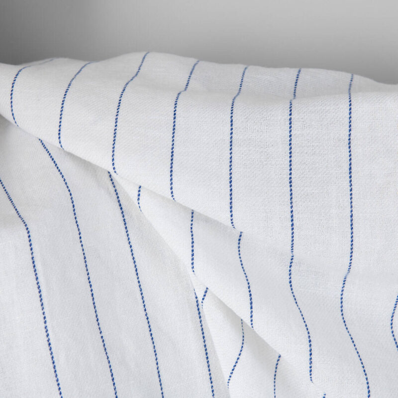 Washed linen cotton fabric white with blue stripes, twill weave