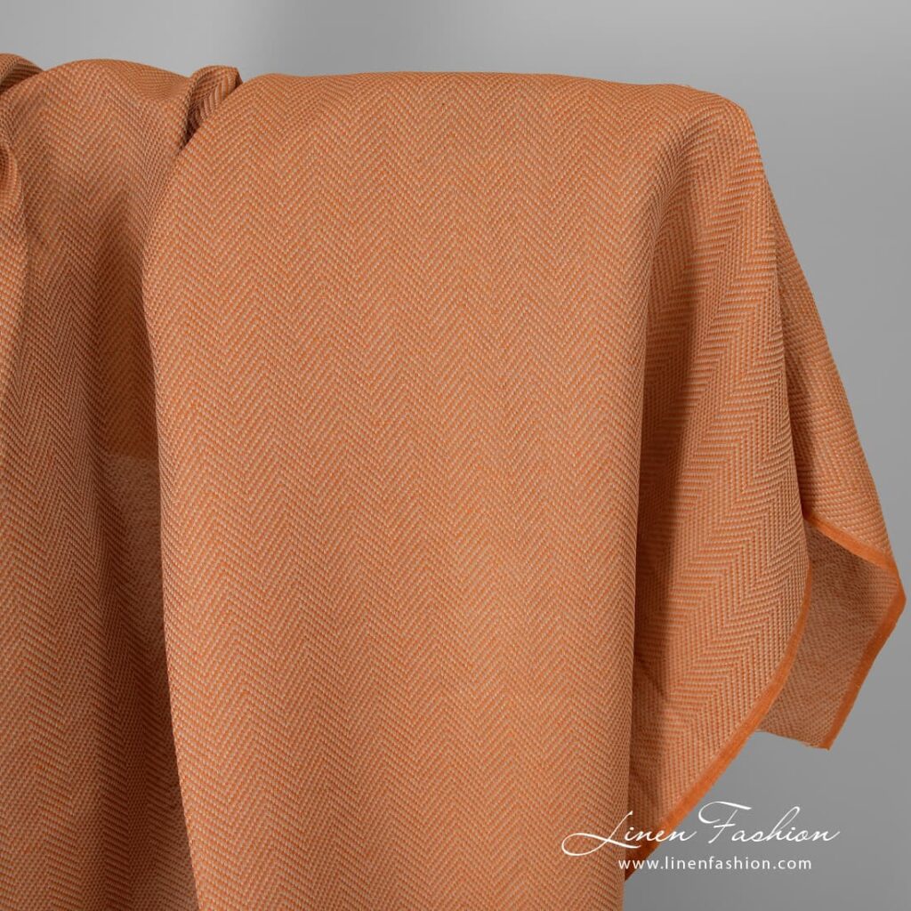Orange linen cotton fabric in herringbone.