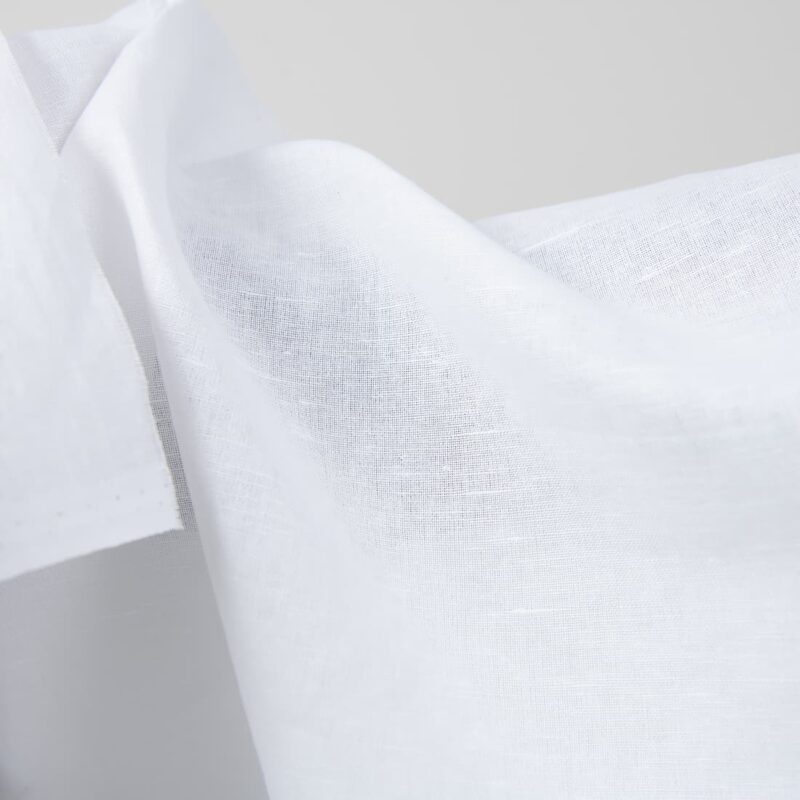 Optical white linen cotton fabric close up detail