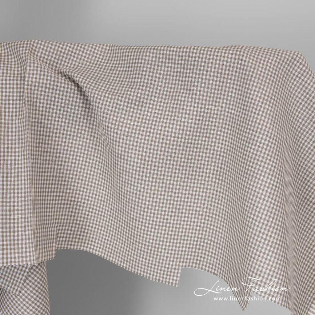 Linen cotton fabric in fine grey white checks.