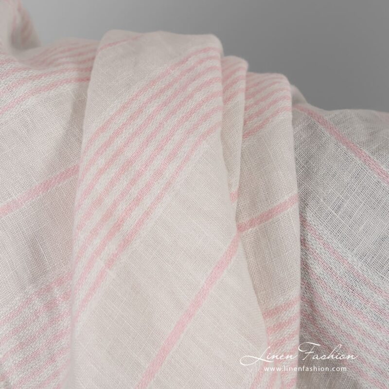 Yellow linen fabric in pink stripes, washed