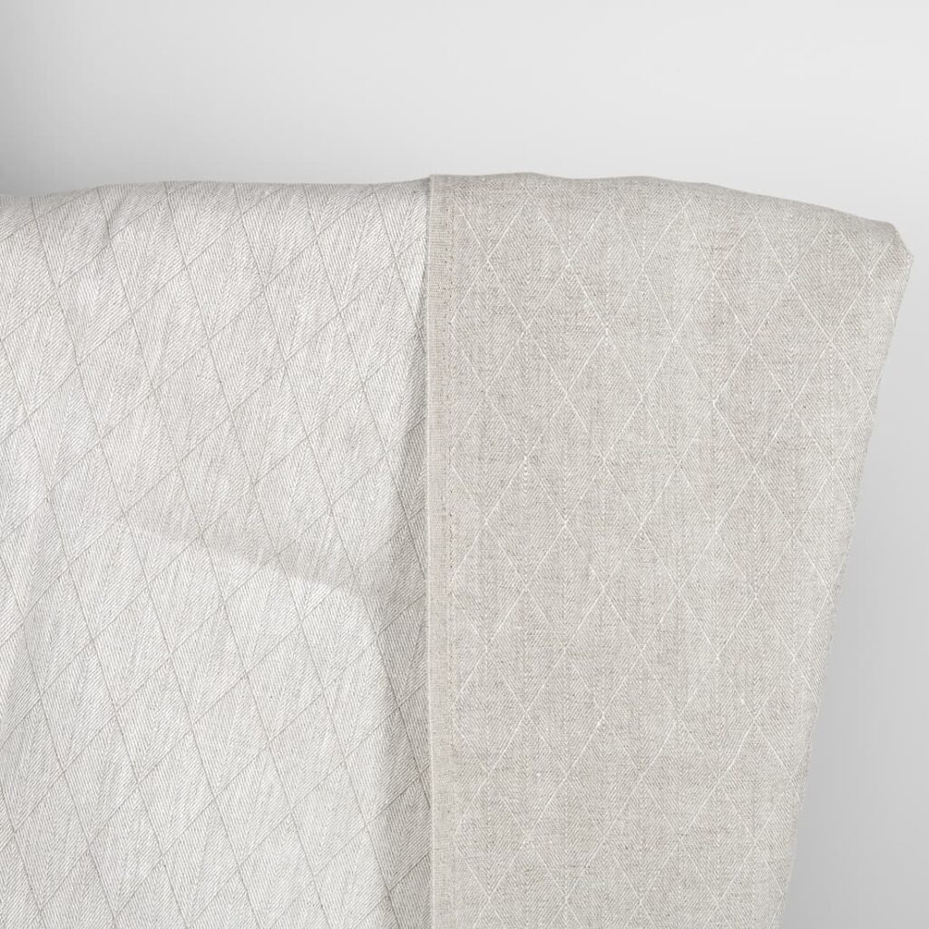 Beige double-sided linen fabric in a diamond pattern