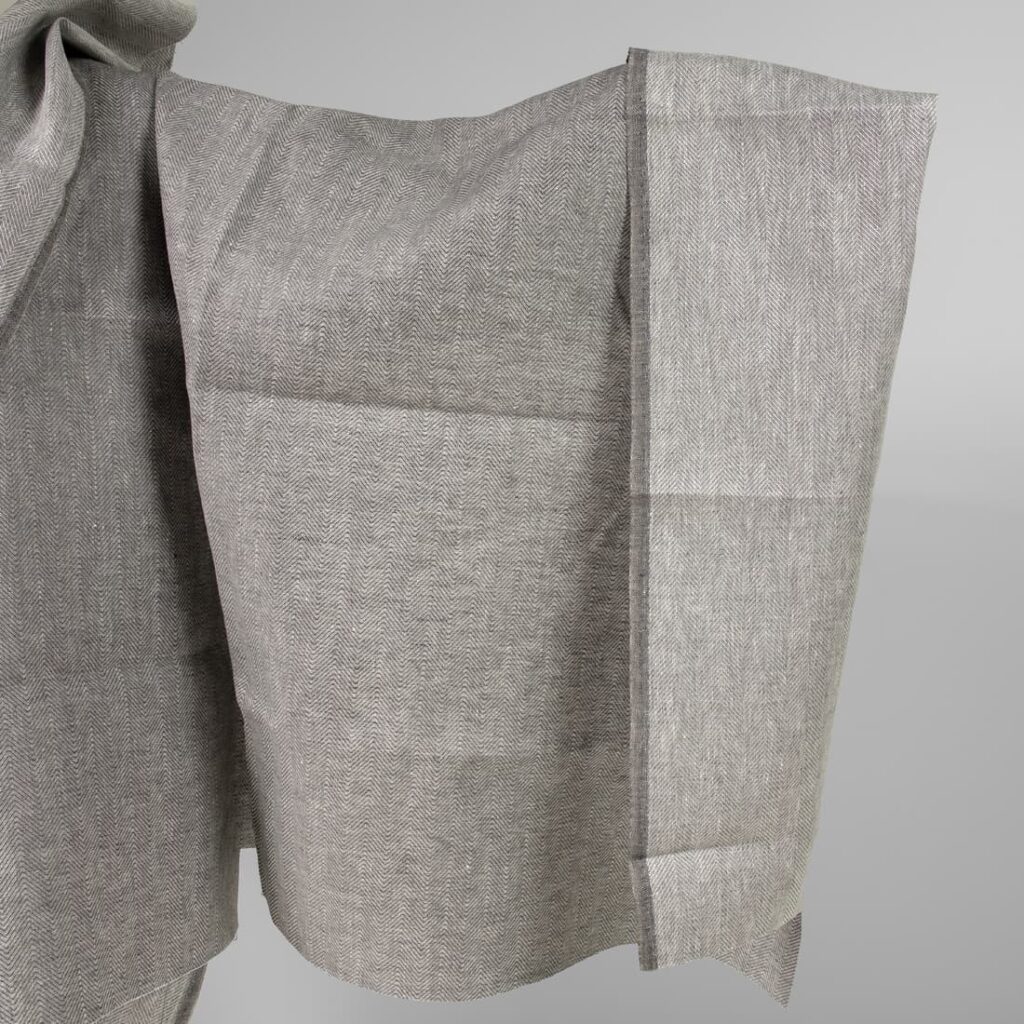 Linen fabric greyish brown in herringbone pattern