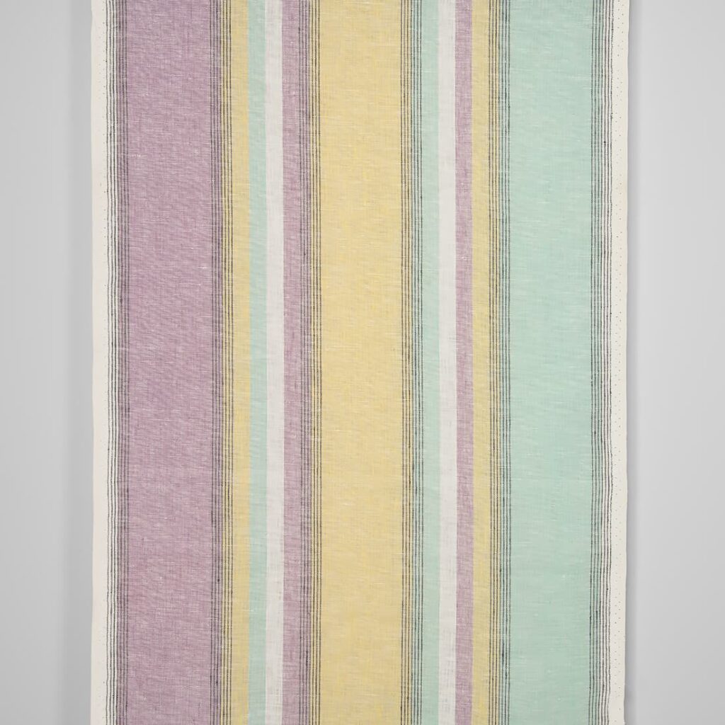 Narrow linen fabric in pastel multicolour stripes