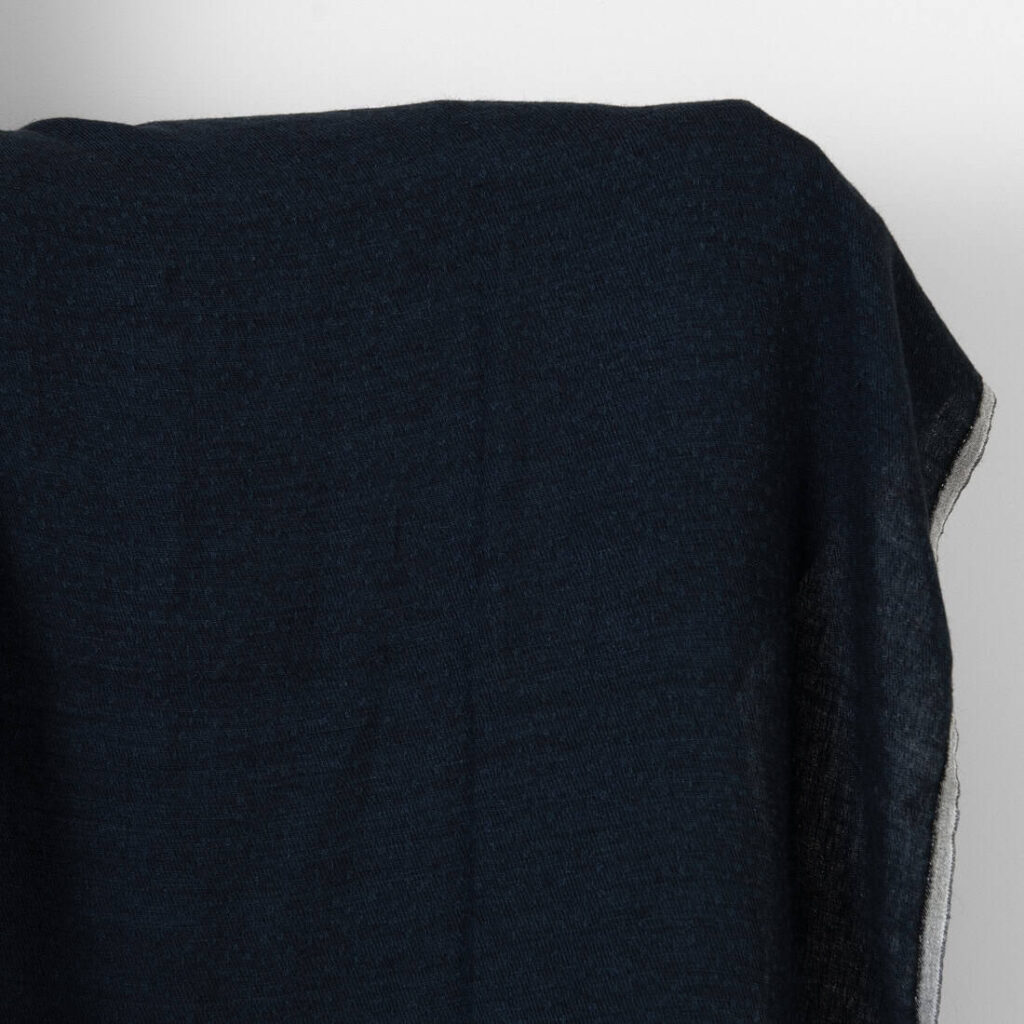 Washed linen wool fabric black with dark blue dots