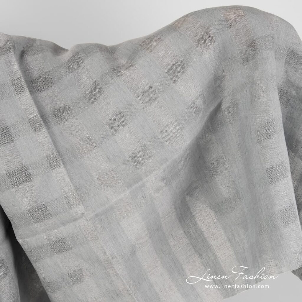Grey linen fabric with sheer checks.