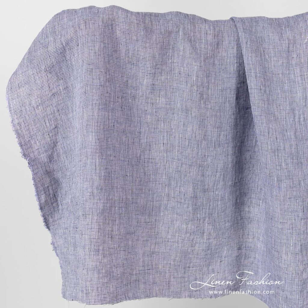 Linen fabric in black violet checks, washed.