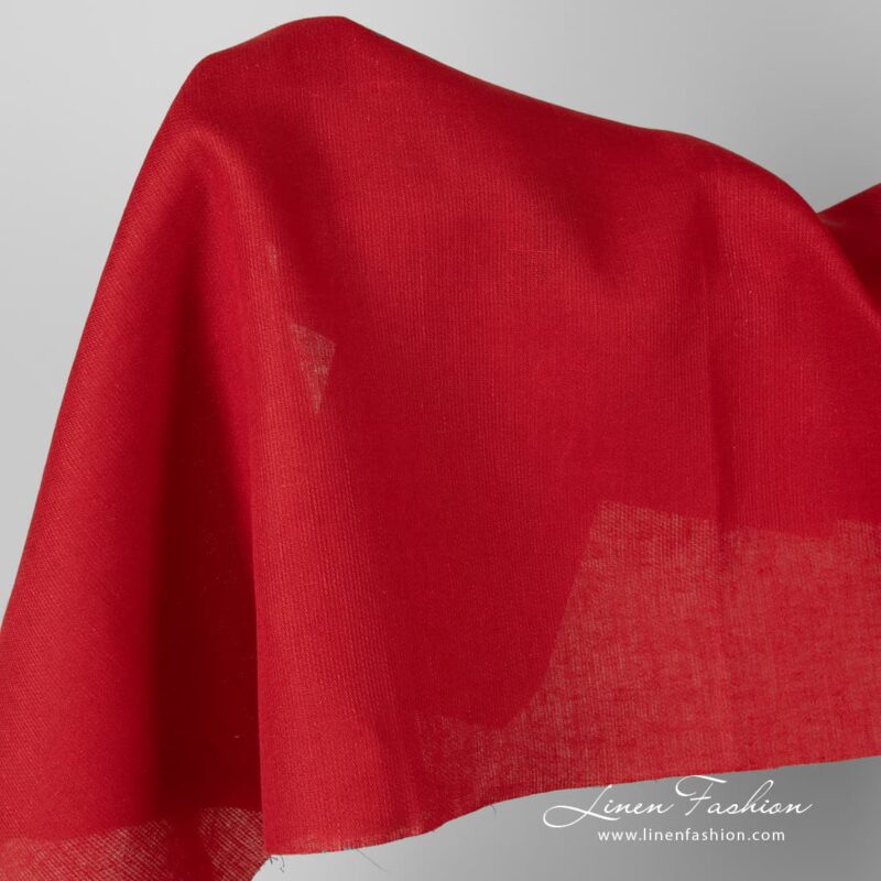 Solid red linen fabric in diagonal pattern.