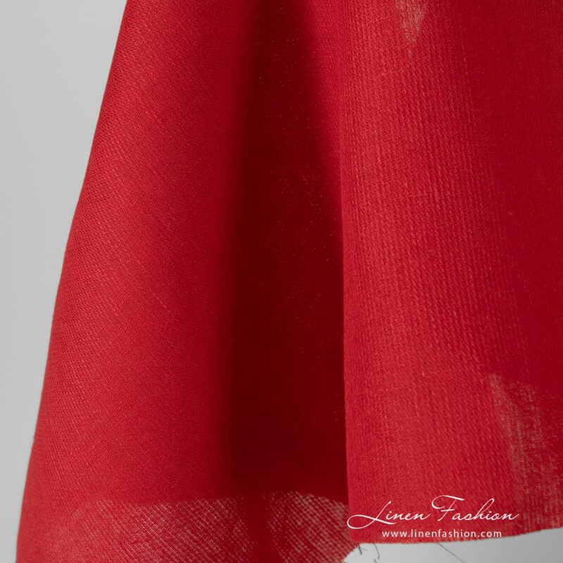 Solid red coloured linen fabric.