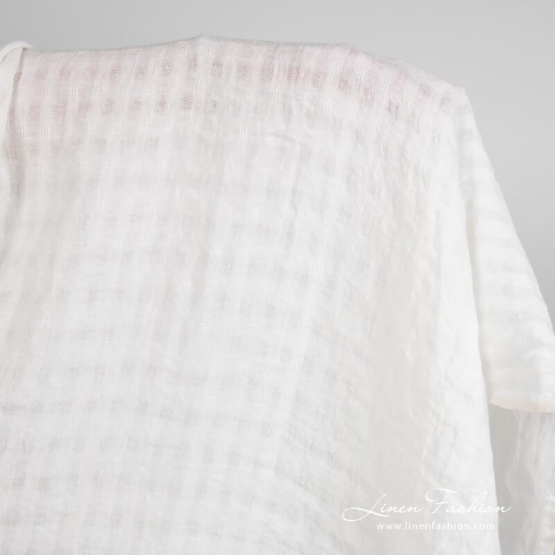 Off-white linen fabric in transparent checks, washed