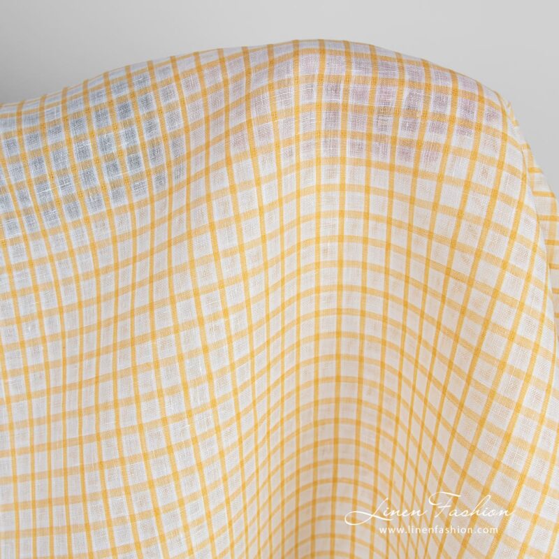 Linen fabric in yellow-white transparent checks