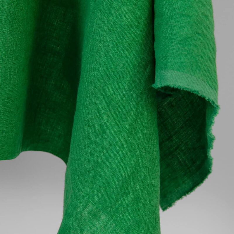 Linen fabric emerald green colour, washed, fabric edge